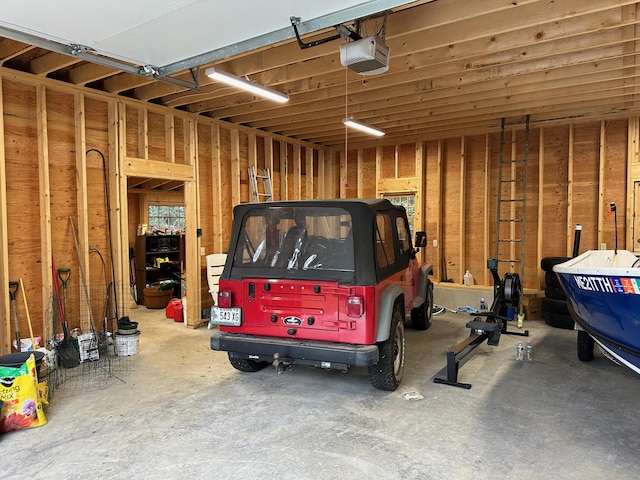 421 Petitmanan Point Rd, Steuben, ME 04680 - garage featuring a garage door opener