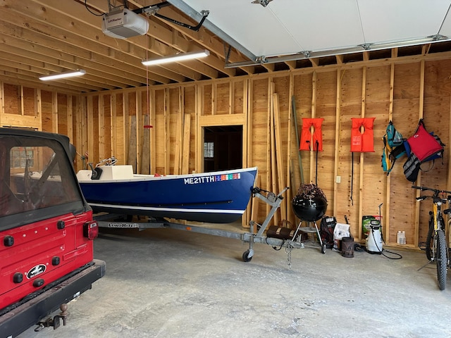 421 Petitmanan Point Rd, Steuben, ME 04680 - garage featuring a garage door opener