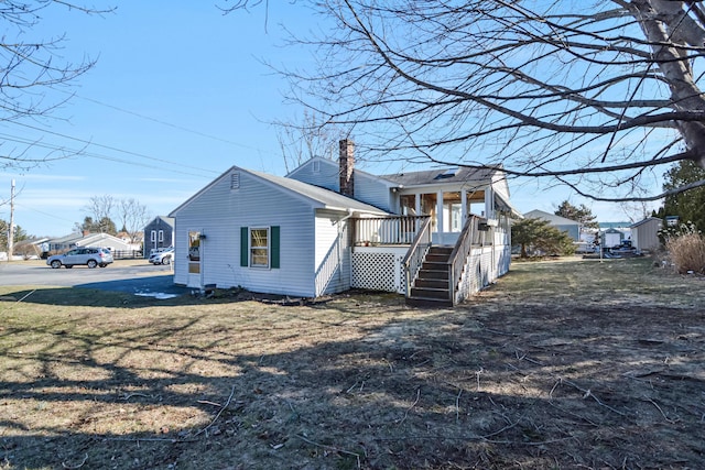 58 Bayview Ter, Wells, ME 04090 - rear view of house featuring a lawn, a chimney, and stairway