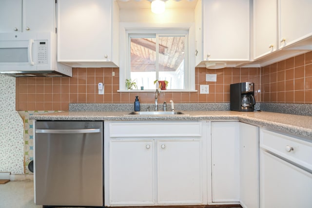 58 Bayview Ter, Wells, ME 04090 - kitchen with white cabinetry, light countertops, a sink, dishwasher, and white microwave