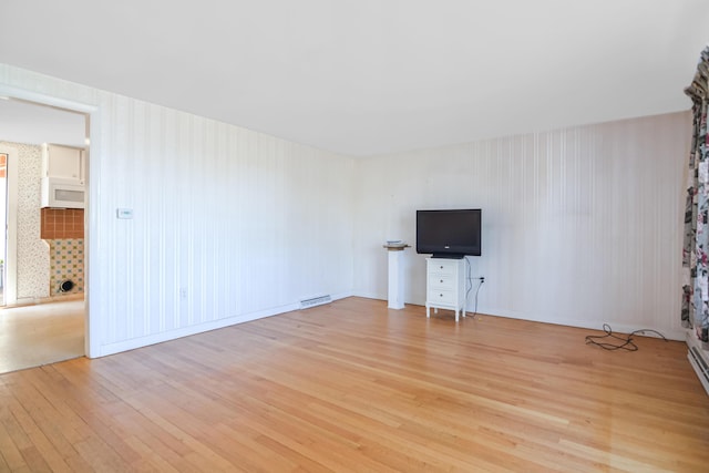 58 Bayview Ter, Wells, ME 04090 - unfurnished living room featuring visible vents and light wood-style flooring