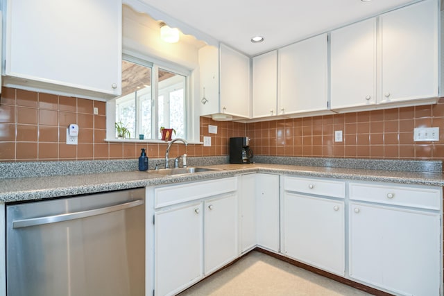 58 Bayview Ter, Wells, ME 04090 - kitchen featuring white cabinetry, backsplash, a sink, and stainless steel dishwasher