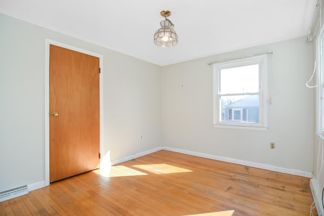58 Bayview Ter, Wells, ME 04090 - spare room with baseboards, light wood-style floors, and a baseboard heating unit