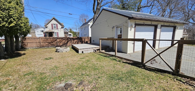 23 Brook St, Waterville, ME 04901 - view of yard featuring a fenced backyard, an outdoor structure, and a garage