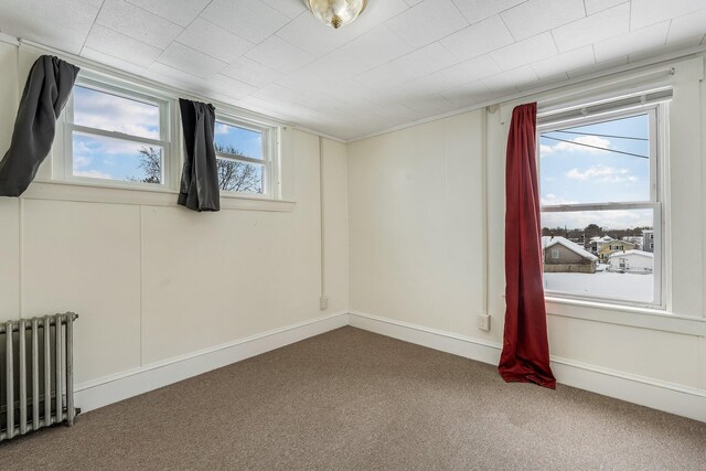 57 Oxford St, Augusta, ME 04330 - carpeted spare room featuring radiator