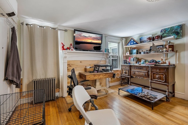 57 Oxford St, Augusta, ME 04330 - home office with a wall mounted air conditioner, radiator heating unit, and hardwood / wood-style flooring