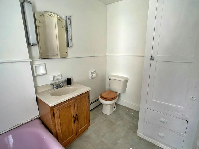 full bathroom with toilet, vanity, a bath, and baseboard heating