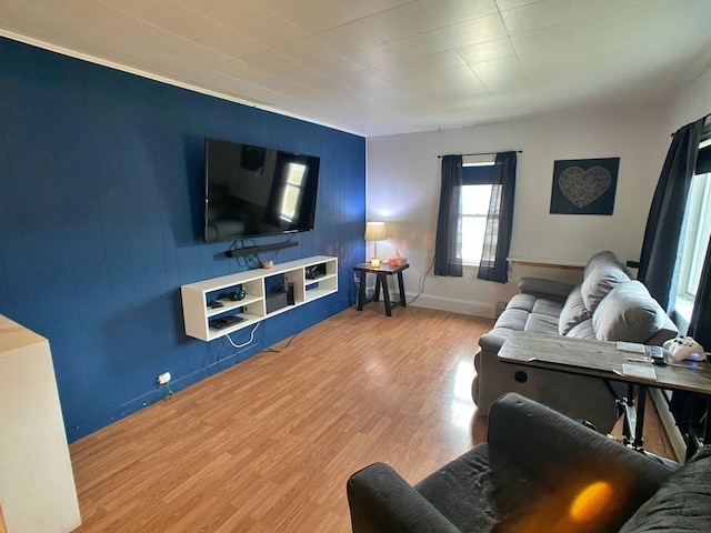 living room featuring baseboards and wood finished floors