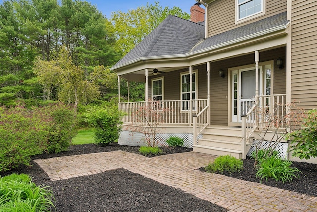 31 Green Trees Dr, Gorham, ME 04038 - doorway to property featuring a porch, a shingled roof, a chimney, and ceiling fan