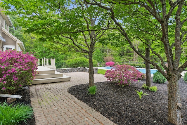 31 Green Trees Dr, Gorham, ME 04038 - view of yard with a wooden deck, an outdoor pool, and a patio area