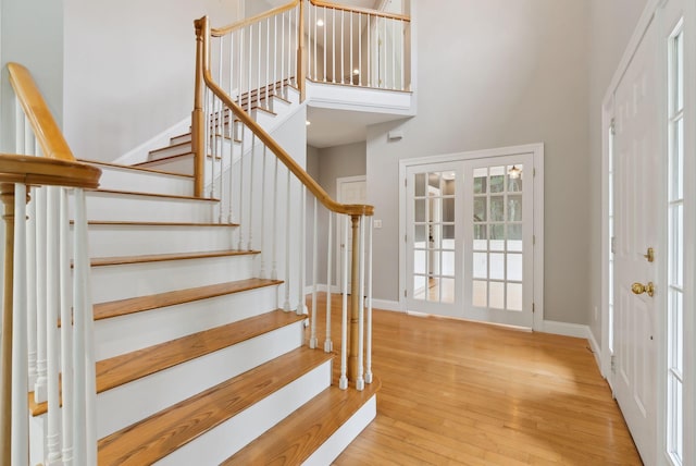 31 Green Trees Dr, Gorham, ME 04038 - stairway with a high ceiling, hardwood / wood-style flooring, baseboards, and french doors