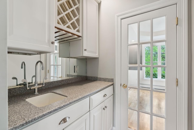 31 Green Trees Dr, Gorham, ME 04038 - kitchen with a sink, white cabinets, and light stone counters