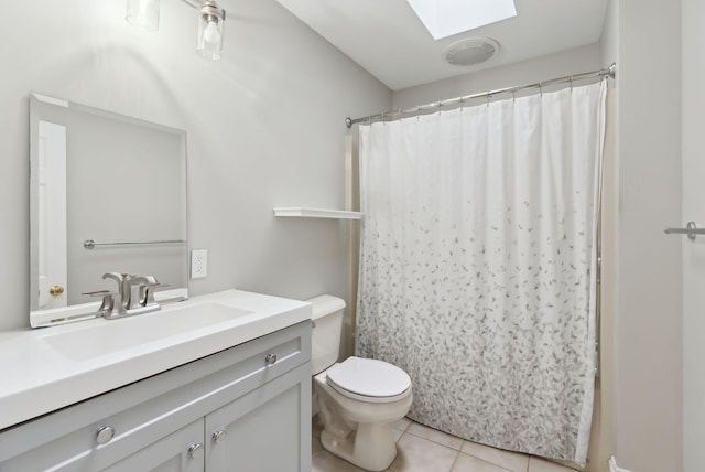 31 Green Trees Dr, Gorham, ME 04038 - bathroom featuring a skylight, vanity, toilet, tile patterned flooring, and a shower with shower curtain