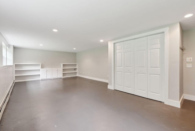 31 Green Trees Dr, Gorham, ME 04038 - unfurnished living room featuring finished concrete flooring, baseboard heating, baseboards, and recessed lighting