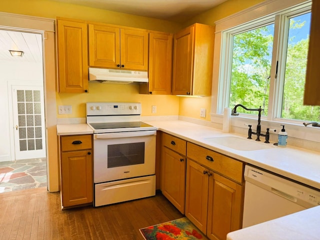 149 Bristol Rd, Damariscotta, ME 04543 - kitchen featuring white appliances, under cabinet range hood, a sink, light countertops, and dark wood-style flooring