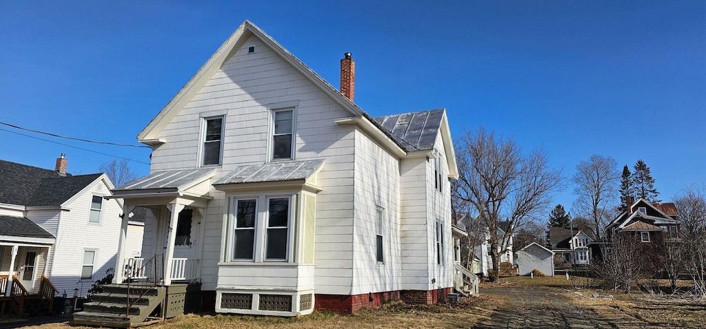 27 Boutelle Ave, Waterville, ME 04901 - view of front of home featuring a chimney