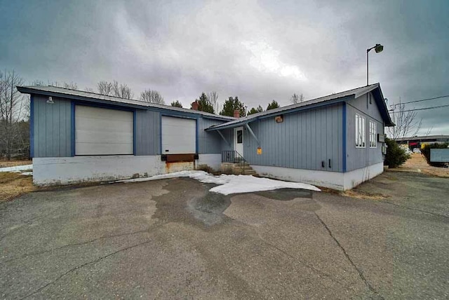 48 Customs Loop, Houlton, ME 04730 - view of front of home featuring a garage