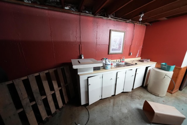 48 Customs Loop, Houlton, ME 04730 - interior space with a sink, white cabinetry, and concrete flooring
