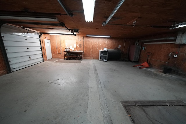 48 Customs Loop, Houlton, ME 04730 - garage featuring water heater, heating fuel, and a workshop area