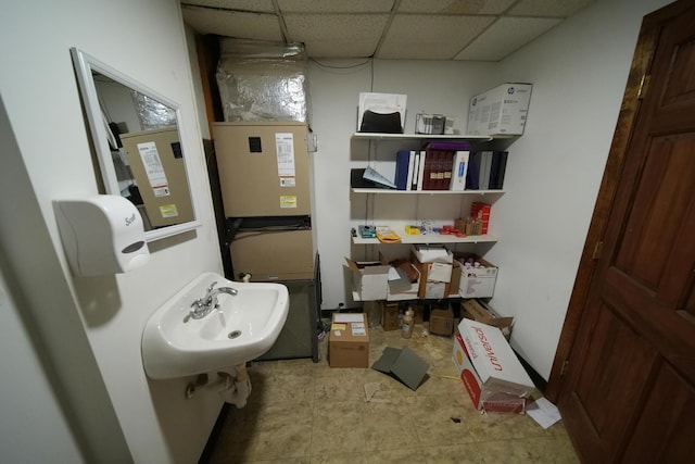 48 Customs Loop, Houlton, ME 04730 - bathroom featuring a sink and a paneled ceiling
