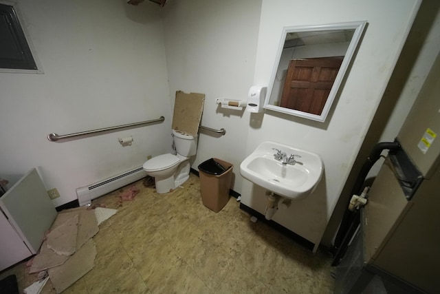 48 Customs Loop, Houlton, ME 04730 - bathroom with tile patterned floors, baseboard heating, toilet, and a sink