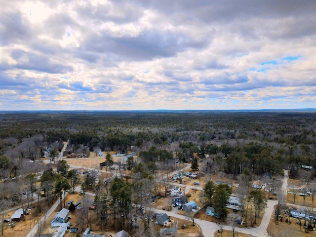 aerial view featuring a wooded view