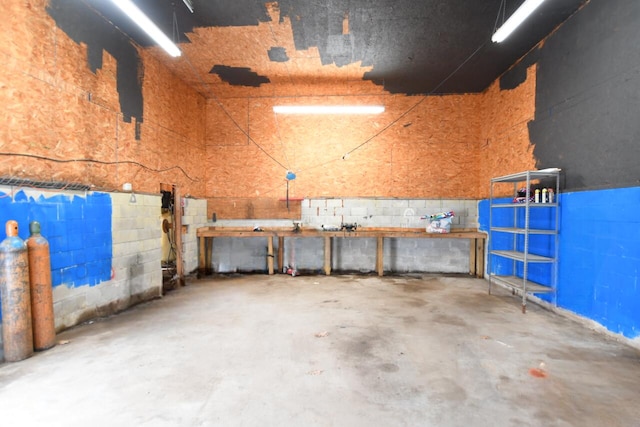 interior space with concrete block wall