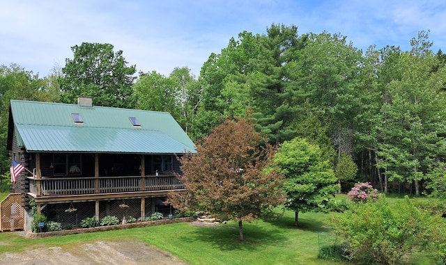 1145 Meadow Pond Rd, Islesboro, ME 04848 - rear view of property featuring a yard, a chimney, and a metal roof