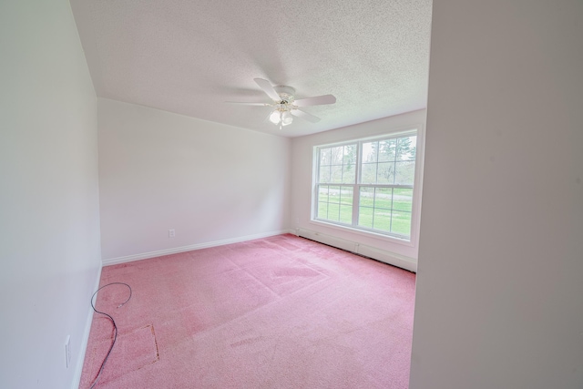 452 Moosehead Trl, Waldo, ME 04915 - unfurnished room with baseboard heating, light carpet, a textured ceiling, ceiling fan, and baseboards