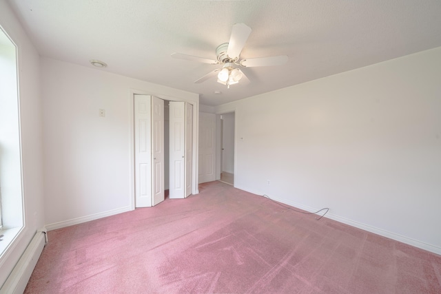 452 Moosehead Trl, Waldo, ME 04915 - unfurnished bedroom featuring a baseboard heating unit, light colored carpet, and baseboards