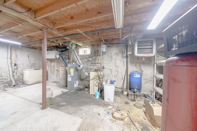 452 Moosehead Trl, Waldo, ME 04915 - unfinished basement with a water pressure tank and water heater