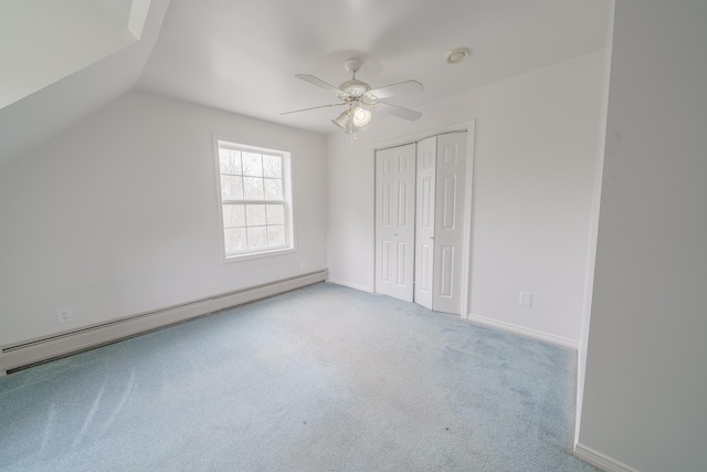 452 Moosehead Trl, Waldo, ME 04915 - unfurnished bedroom featuring baseboard heating, a closet, carpet floors, vaulted ceiling, and a ceiling fan