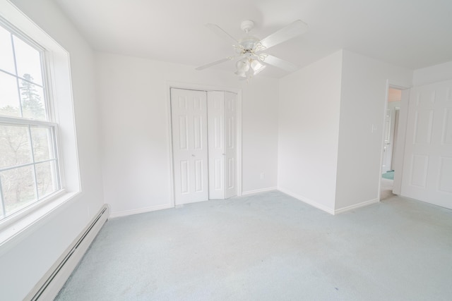 452 Moosehead Trl, Waldo, ME 04915 - unfurnished bedroom with baseboard heating, multiple windows, and light carpet