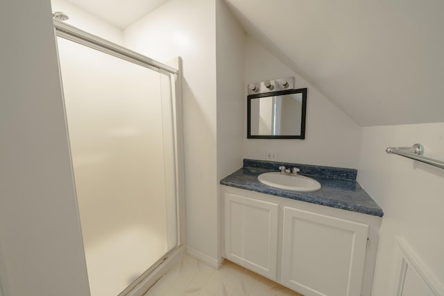 452 Moosehead Trl, Waldo, ME 04915 - bathroom featuring lofted ceiling, vanity, a stall shower, and tile patterned floors