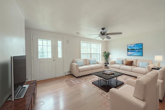 452 Moosehead Trl, Waldo, ME 04915 - living room featuring wood finished floors, baseboard heating, and a ceiling fan