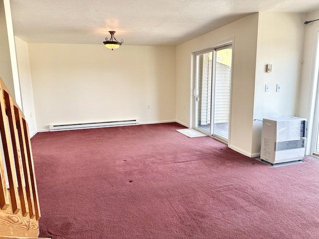 carpeted spare room featuring a baseboard radiator, heating unit, baseboards, and a textured ceiling