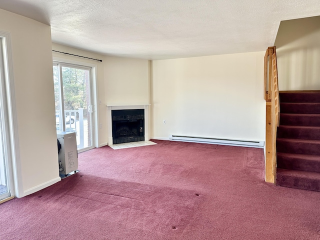 unfurnished living room with stairway, a fireplace with flush hearth, carpet, a textured ceiling, and baseboard heating