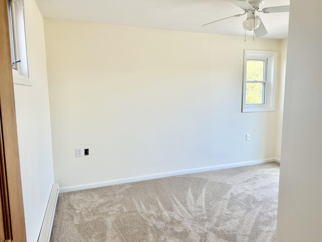 empty room with carpet flooring, baseboards, and baseboard heating