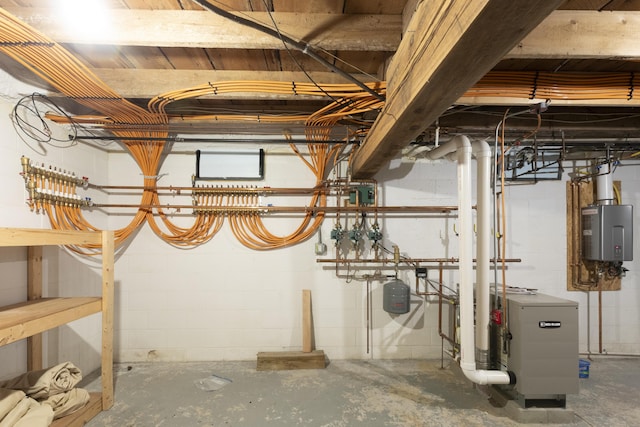 unfinished basement featuring a heating unit and tankless water heater