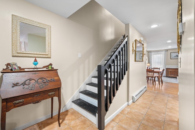stairs with a baseboard radiator, tile patterned floors, baseboards, and recessed lighting