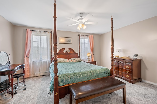 bedroom featuring baseboards, carpet, multiple windows, and baseboard heating