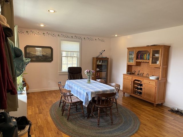 148 Pendleton Point Rd, Islesboro, ME 04848 - dining room with light wood-type flooring, recessed lighting, baseboards, and a bar
