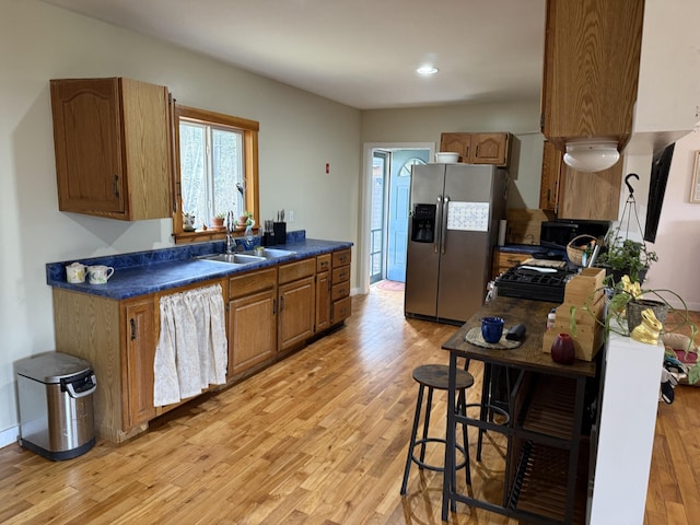 148 Pendleton Point Rd, Islesboro, ME 04848 - kitchen with stainless steel fridge, a sink, light wood finished floors, gas stove, and recessed lighting