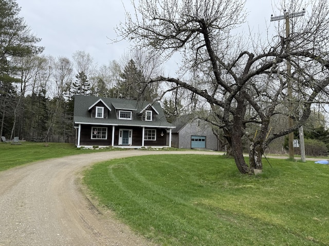 148 Pendleton Point Rd, Islesboro, ME 04848 - cape cod-style house with curved driveway, covered porch, and a front yard