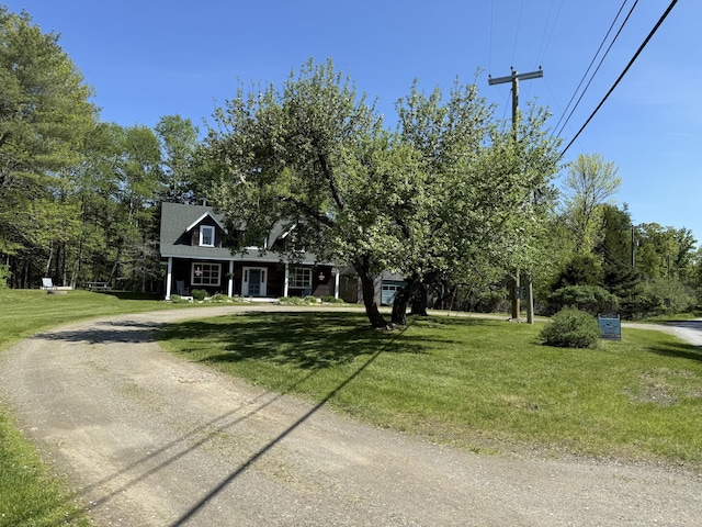 148 Pendleton Point Rd, Islesboro, ME 04848 - view of front facade featuring dirt driveway and a front yard