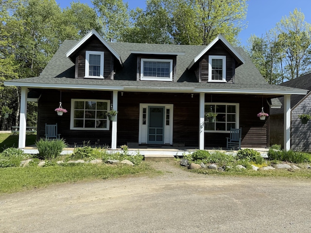 148 Pendleton Point Rd, Islesboro, ME 04848 - view of front of property with covered porch and a shingled roof