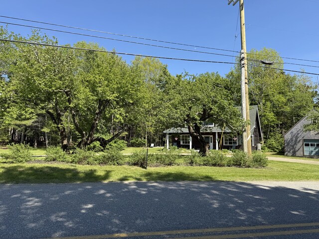 148 Pendleton Point Rd, Islesboro, ME 04848 - obstructed view of property with a front yard