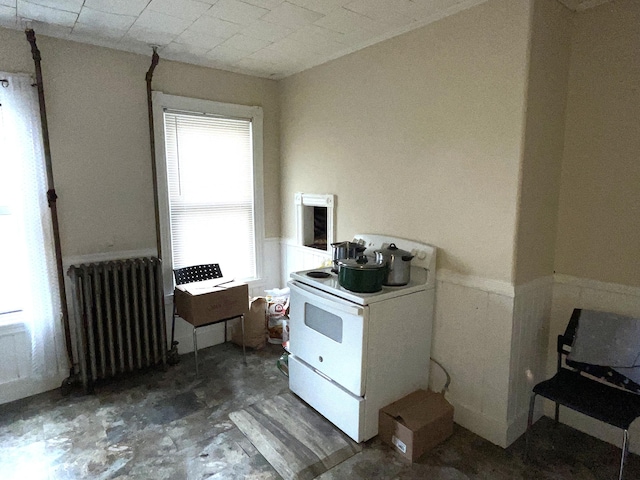 613 Washington Ave, Portland, ME 04103 - misc room with radiator heating unit and a wainscoted wall