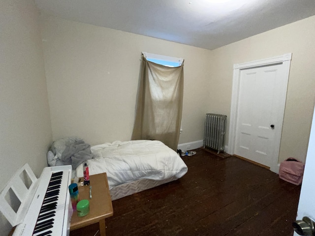 613 Washington Ave, Portland, ME 04103 - bedroom with radiator and wood finished floors