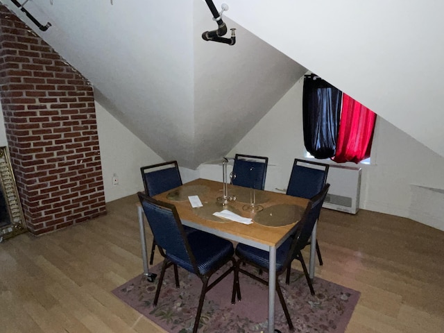 613 Washington Ave, Portland, ME 04103 - dining space with vaulted ceiling and wood finished floors